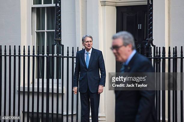 British Chancellor of the Exchequer Philip Hammond is pictured as he greets Australian High Commissioner to the United Kingdom Alexander Downer and...
