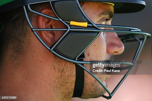 Marcus Stoinis of the Stars looks on while waiting to bat during the Big Bash League match between the Perth Scorchers and the Melbourne Stars at the...