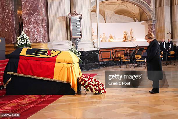 German Chancellor Angela Merkel pays her respects at the state funeral of the late former German President Roman Herzog at the Dom Cathedral on...