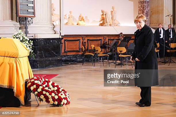 German Chancellor Angela Merkel pays her respects at the state funeral of the late former German President Roman Herzog at the Dom Cathedral on...