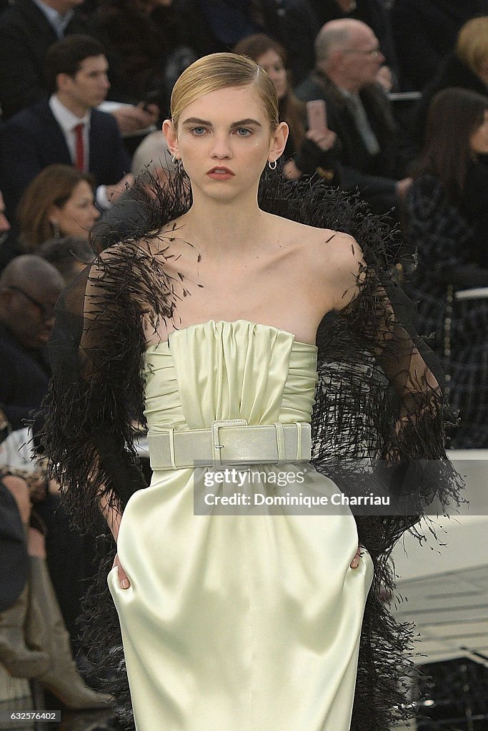 A model walks the runway during the Chanel Haute Couture Spring... News ...