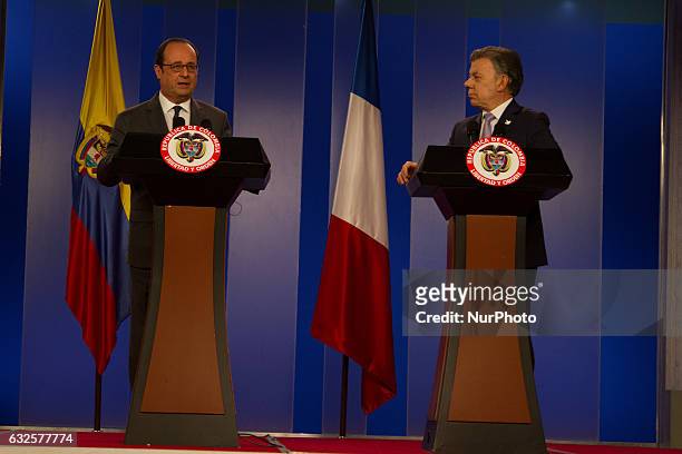 Colombian President Juan Manuel Santos speaks next to his French counterpart Francois Hollande during a cultural event as part of the Colombia-France...