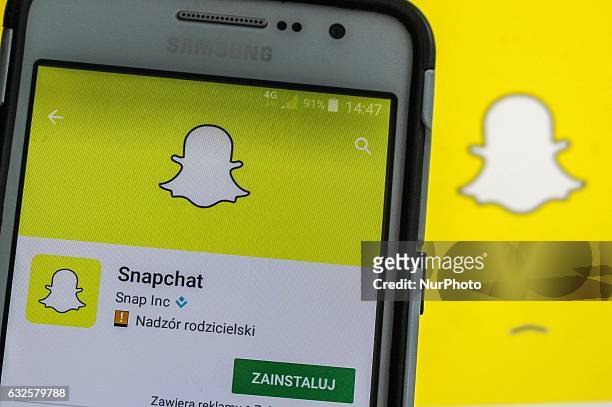 Man holding Samsung smartphone in hand, with Snapchat app running is seen in Gdansk, Poland on 24 January 2017 Snapchat worth a small fraction of its...