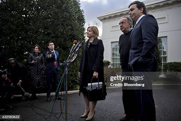 Mary Barra, chief executive officer of General Motors Co. , center, Mark Fields, president and chief executive officer of Ford Motor Co., right, and...