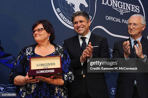 Debbie Kepitis receives the third Longines Worlds Best Racehorse Award with Vice President of Longines & Head of International Marketing,...