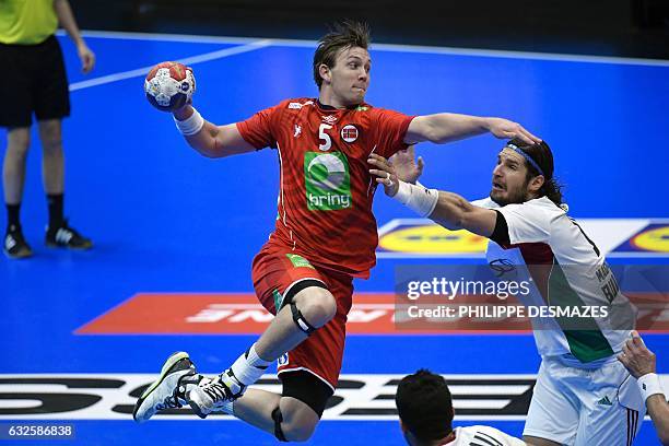 Norway's centre back Sander Sagosen jumps to shoot on goal over Hungary's right back Laszlo Nagy during the 25th IHF Men's World Championship 2017...