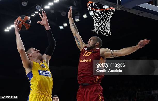 Blake Schilb of Galatasaray Odeabank in action against Colton Iverson of Maccabi Fox Tel Aviv during the Turkish Airlines Euroleague basketball match...