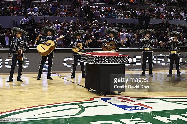 Mariachi band helps present the commissioner with a cake during the San Antonio Spurs game against the Phoenix Suns part of NBA Global Games at Arena...