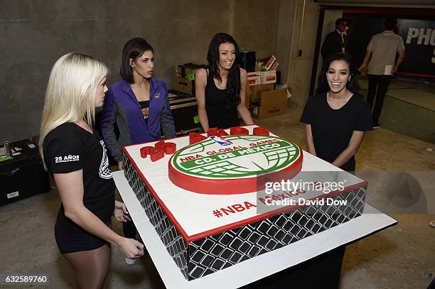 The Phoenix Suns dance team gets ready to present the commissioner with a cake during the San Antonio Spurs game against the Phoenix Suns as part of...