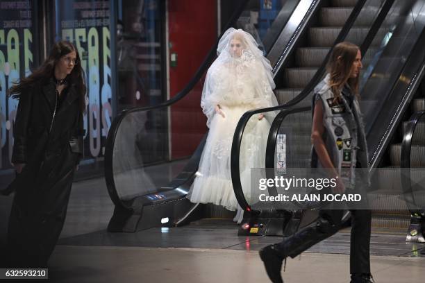 Model presents a creation for Vetements during the 2017 spring/summer prêt-à-porter collection on January 24, 2017 in Paris. / AFP PHOTO / ALAIN...