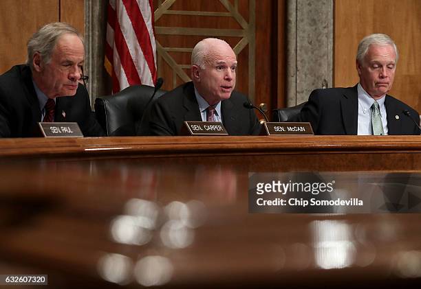 Senate Homeland Security and Governmental Affairs Committee member Sen. John McCain questions Rep. Mick Mulvaney during his confirmation hearing to...