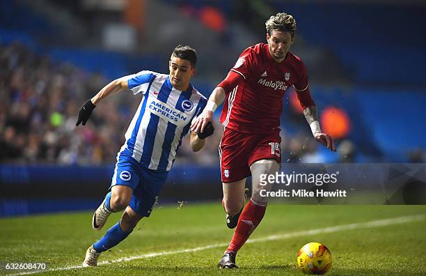 Anthony Knockaert of Brighton and Hove Albion and Greg Halford of Cardiff City chase the ball during the Sky Bet Championship match between Brighton...
