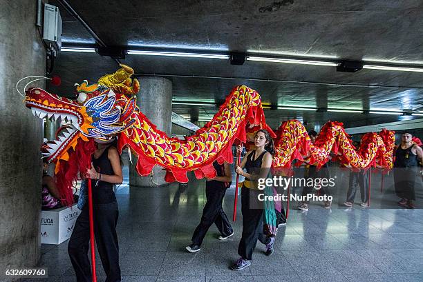 People perform dragon dance to announce Chinese Lunar New Year celebrations at Metro's Sé Station in Sao Paulo, Brazil, on January 24, 2017. The...