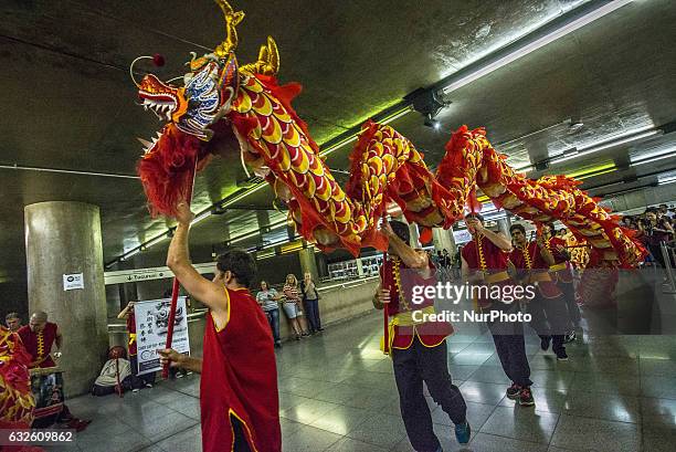 People perform dragon dance to announce Chinese Lunar New Year celebrations at Metro's Sé Station in Sao Paulo, Brazil, on January 24, 2017. The...