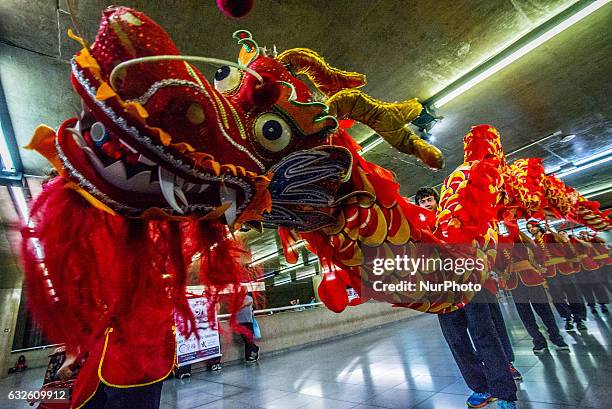 People perform dragon dance to announce Chinese Lunar New Year celebrations at Metro's Sé Station in Sao Paulo, Brazil, on January 24, 2017. The...