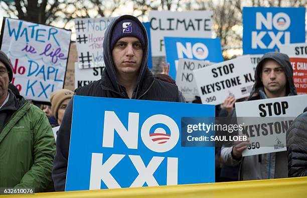Opponents of the Keystone XL and Dakota Access pipelines hold a rally as they protest US President Donald Trump's executive orders advancing their...