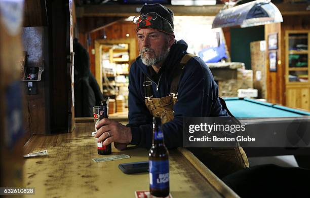 Ira Shank, of Gloucester enjoys a beer after a day of work as a lobsterman inside the bar Pratty's CAV in Gloucester, MA, where "Manchester By The...