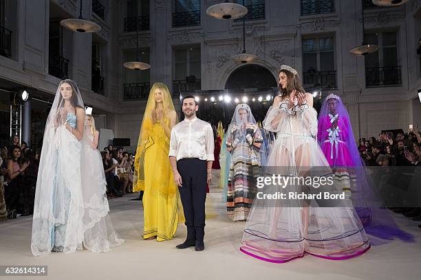 Designer Alexis Mabille pose with models after the Alexis Mabille Spring Summer 2017 show as part of Paris Fashion Week on January 24, 2017 in Paris,...