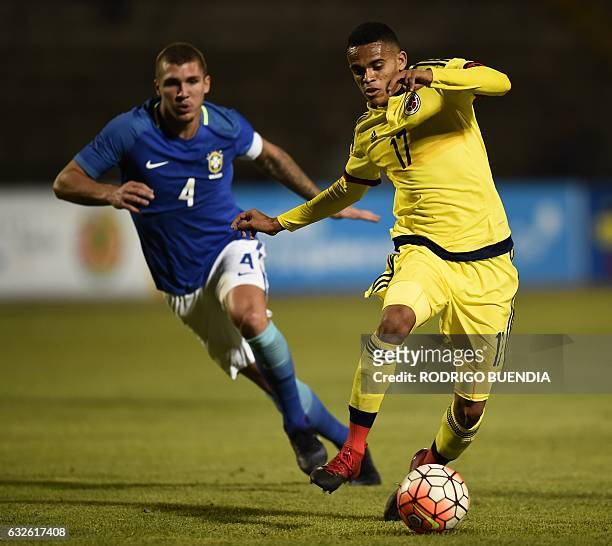 Brazil's Lyanco and Colombia's Luis Diaz vie for the ball during their U20 South American Championship football match, at the Olympic Stadium in...