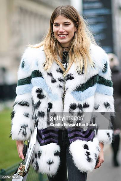 Veronika Heilbrunner wears a fur coat, outside the Chanel show, at the Grand Palais, during Paris Fashion Week Haute Couture Spring Summer 2017, on...
