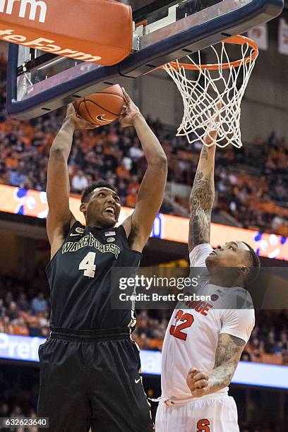 DaJuan Coleman of the Syracuse Orange fouls Doral Moore of the Wake Forest Demon Deacons as he shoots the ball during the first half on January 24,...