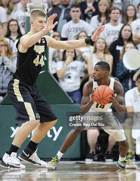 Eron Harris of the Michigan State Spartans looks to pass the basketball against Isaac Haas of the Purdue Boilermakers in the second half at the...