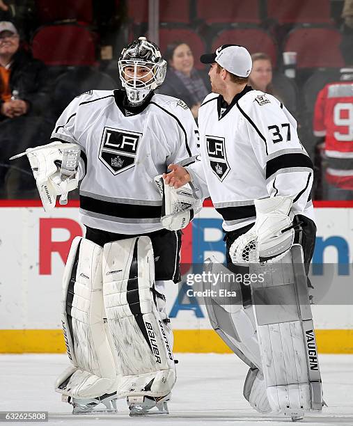 Peter Budaj of the Los Angeles Kings is congratulated by teammate Jeff Zatkoff after the 3-1 win over the New Jersey Devils on January 24, 2017 at...