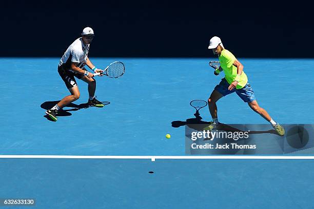 Marc Polmans and Andrew Whittington of Australia compete in their quarterfinal match against Pierre-Hugues Herber and Nicolas Mahut of France on day...