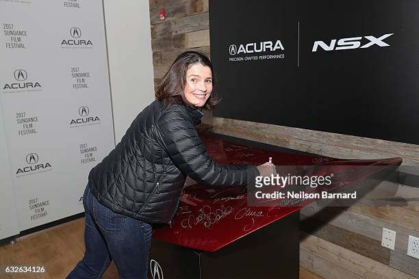 Actress Julia Ormond signs the hood of a 2017 Acura NSX during "The Last Word" Party at the Acura Studio at Sundance Film Festival 2017 on January...