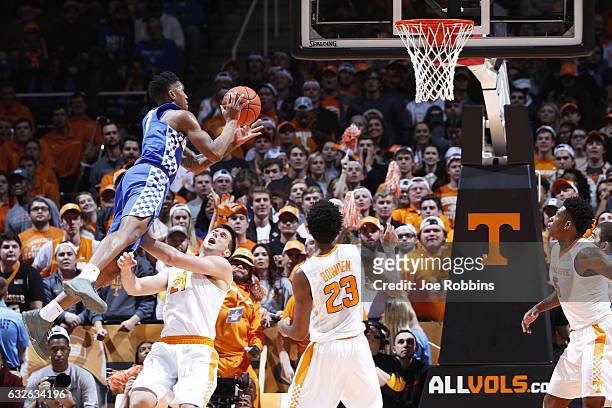 Malik Monk of the Kentucky Wildcats drives to the basket against Lew Evans of the Tennessee Volunteers in the first half of the game at...