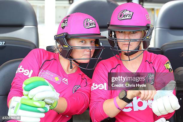 Alyssa Healy and Dane van Niekerk of the Sixers looks on during the Women's Big Bash League semi final match between the Sydney Sixers and the Hobart...