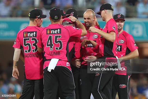 Nathan Lyon of the Sixers celebrates dismissing Sam Heazlett of the Heat during the Big Bash League semi final match between the Brisbane Heat and...