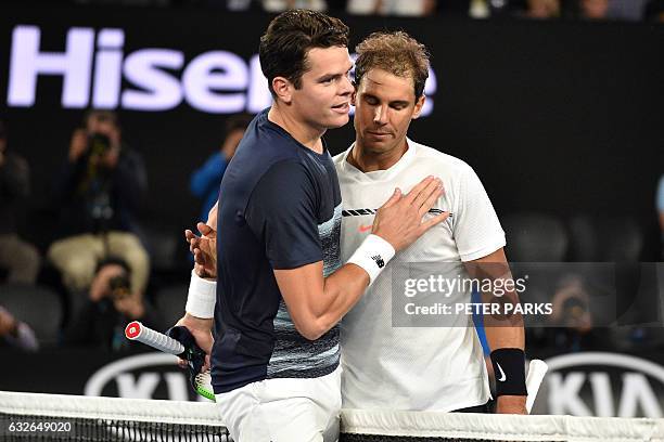 Canada's Milos Raonic congratulates Spain's Rafael Nadal after their men's singles quarter-final match on day ten of the Australian Open tennis...