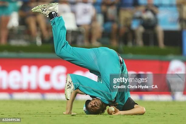 Joe Burns of the Heat takes a catch to dismiss Moises Henriques of the Sixers during the Big Bash League semi final match between the Brisbane Heat...