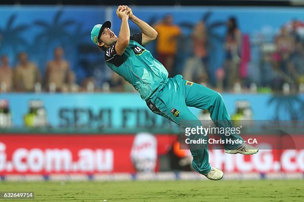 Joe Burns of the Heat takes a catch to dismiss Moises Henriques of the Sixers during the Big Bash League semi final match between the Brisbane Heat...