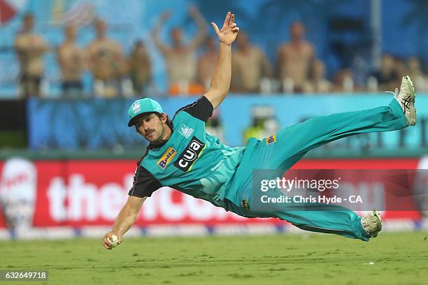 Joe Burns of the Heat takes a catch to dismiss Moises Henriques of the Sixers during the Big Bash League semi final match between the Brisbane Heat...