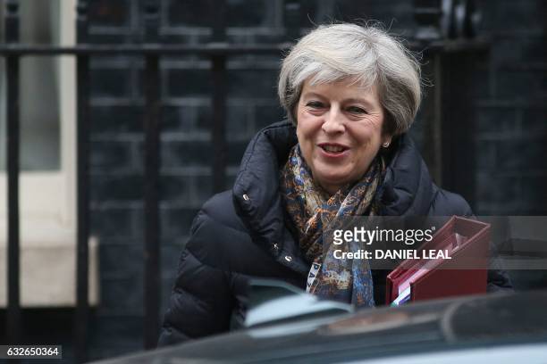 Britain's Prime Minister Theresa May leaves 10 Downing Street in central London on January 25, 2017 to attend the weekly Prime Minister's Questions...