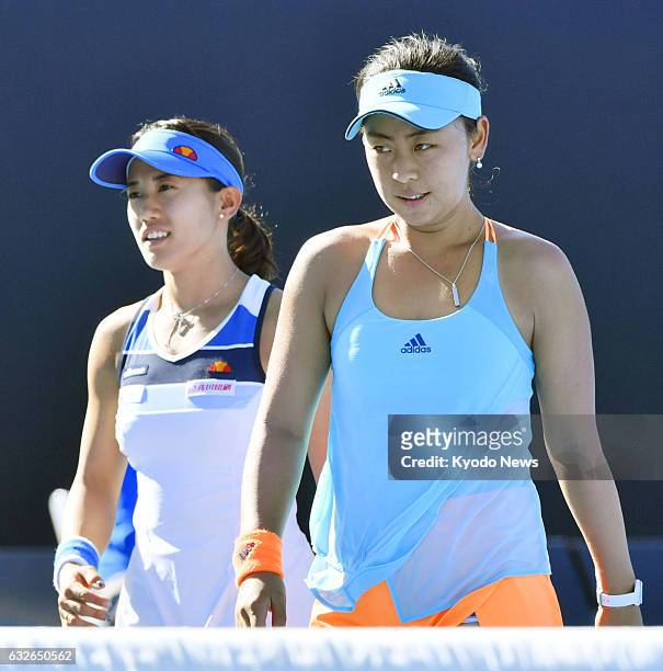 Japan's Eri Hozumi and Miyu Kato react after losing to Bethanie Mattek-Sands of the United States and Czech Lucie Safarova in the Australian Open...