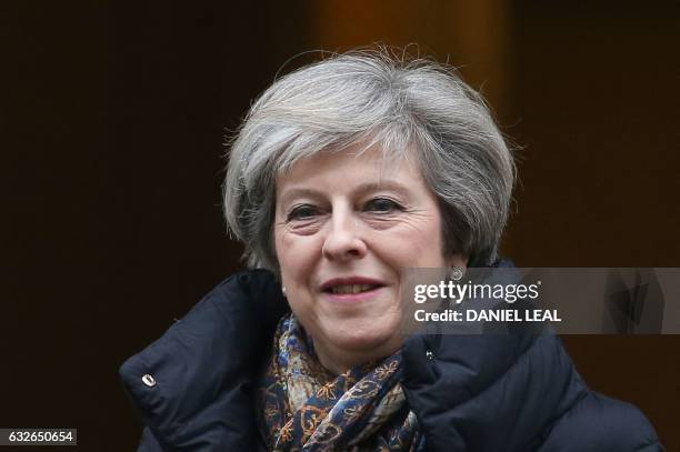 Britain's Prime Minister Theresa May leaves 10 Downing Street in central London on January 25, 2017 to attend the weekly Prime Minister's Questions...