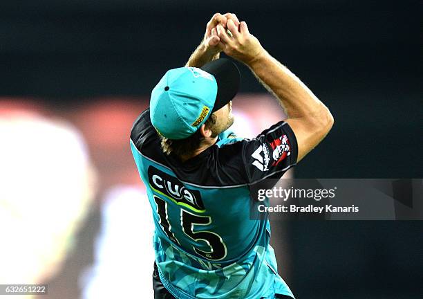 Joe Burns of the Heat takes a catch to dismiss Henriques Moises of the Sixers during the Big Bash League semi final match between the Brisbane Heat...