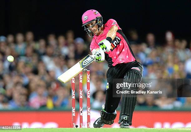 Johan Botha of the Sixers hits the ball to the boundary for a four during the Big Bash League semi final match between the Brisbane Heat and the...