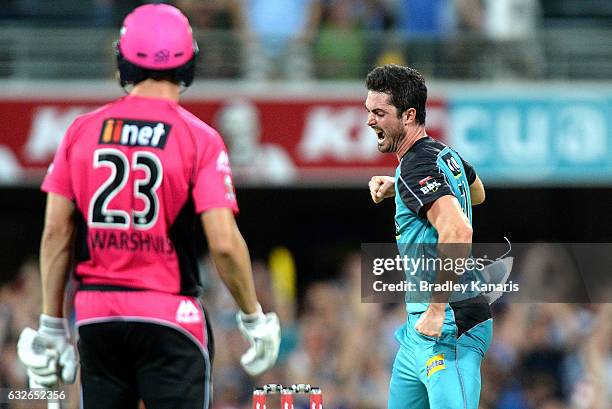 Ben Cutting of the Heat celebrates taking the wicket of Johan Botha of the Sixers during the Big Bash League semi final match between the Brisbane...