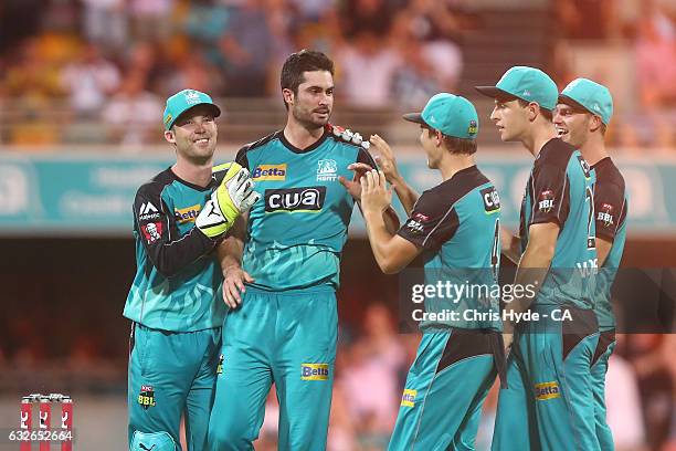 Ben Cutting of the Heat celebrates dismissing Johan Botha of the Sixers during the Big Bash League semi final match between the Brisbane Heat and the...