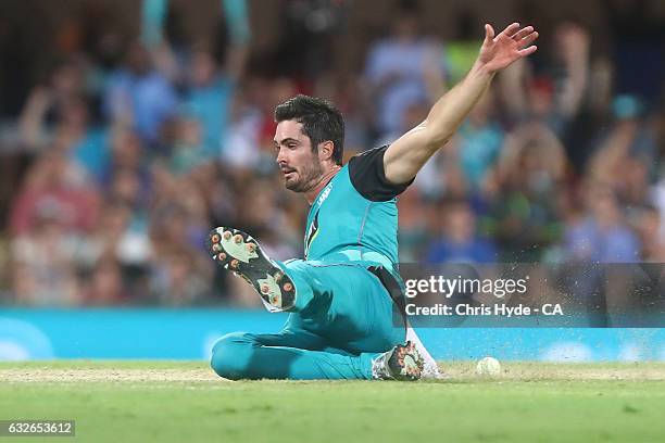 Ben Cutting of the Heat fields during the Big Bash League semi final match between the Brisbane Heat and the Sydney Sixers at the The Gabba on...