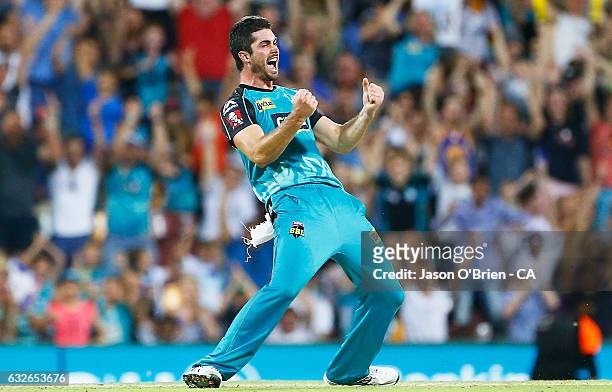 Ben Cutting of the Heat celebrates the wicket of Johan Botha during the Big Bash League semi final match between the Brisbane Heat and the Sydney...