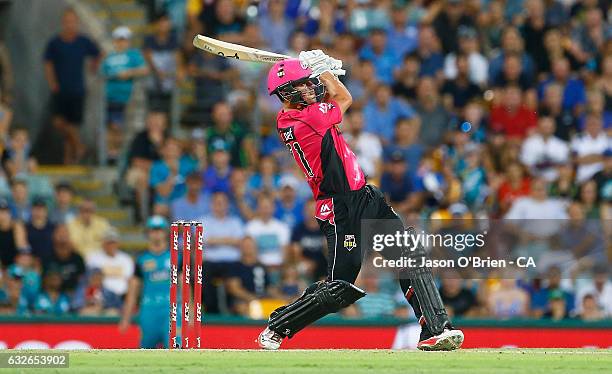 Moises Henriques of the Sixers hits a six during the super over during the Big Bash League semi final match between the Brisbane Heat and the Sydney...