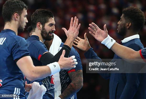 Nikola Karabatic of France celebrates the victory with teammates following the 25th IHF Men's World Championship 2017 Quarter Final match between...