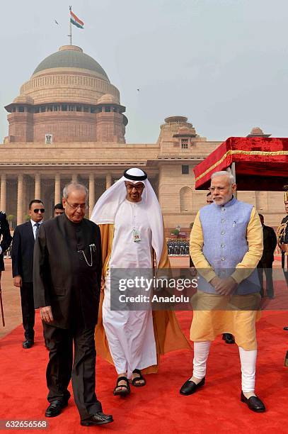 The Crown Prince of Abu Dhabi General Sheikh Mohammed Bin Zayed Al Nahyan shakes hands with Indian Prime Minister Narendra Modi ahead of a meeting at...