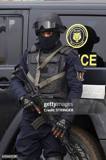 An Egyptian policeman stands guard on Cairo's landmark Tahrir Square on January 25 during celebrations marking the sixth anniversary of the 2011...