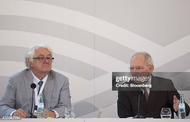 Hasso Plattner, chairman of SAP SE, left, looks on as Wolfgang Schaeuble, Germany's finance minister, speaks during the G20 Digitising Finance...